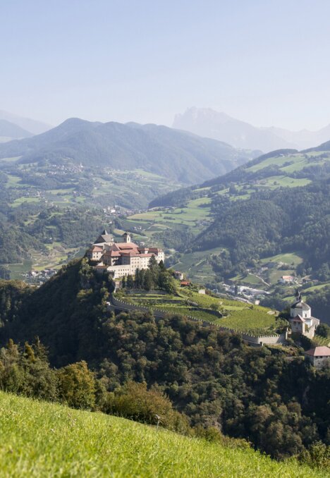 Green hills and villages spread across the valley near Brixen Südtirol.